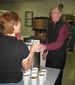 84227-steve_kincaid_ceo_of_kincaid_furniture_serves_drinks_during_the_company_s_holiday_get_together_